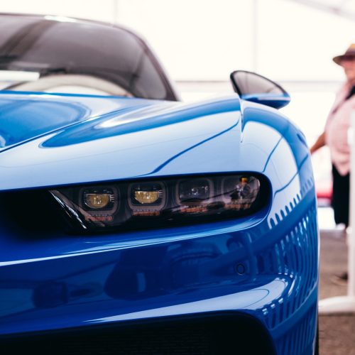 A closeup shot of a cool luxurious blue car ready to take on and take you to the stars A closeup shot of a cool luxurious blue car ready to take on and take you to the stars