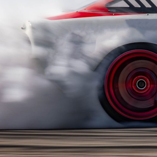 Blurred car drifting diffusion race drift car with lots of smoke from burning tires on speed track, Professional driver drifting car on race track with smoke. Blurred car drifting diffusion race drift car with lots of smoke from burning tires on speed track, Professional driver drifting car on race track with smoke.